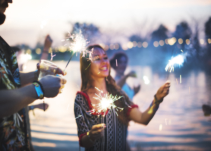 Woman Enjoying Sparkler in Festival Event